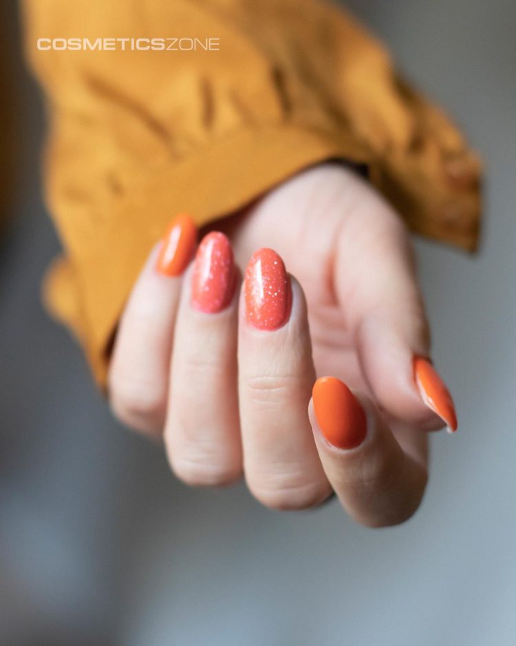 Pomarańczowy lakier hybrydowy - kolor idealny na upalne lato! Jak wykorzystać go w stylizacji?